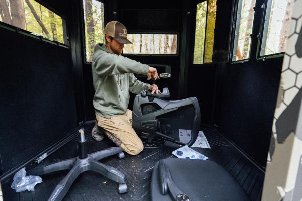man working inside a blind 