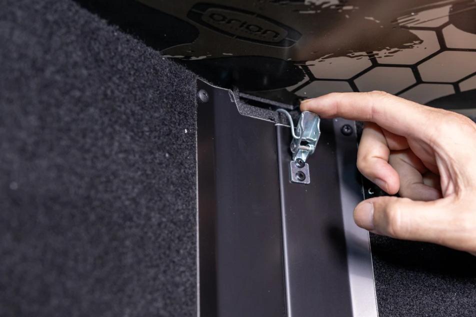 Hands showing a blind set-up process 