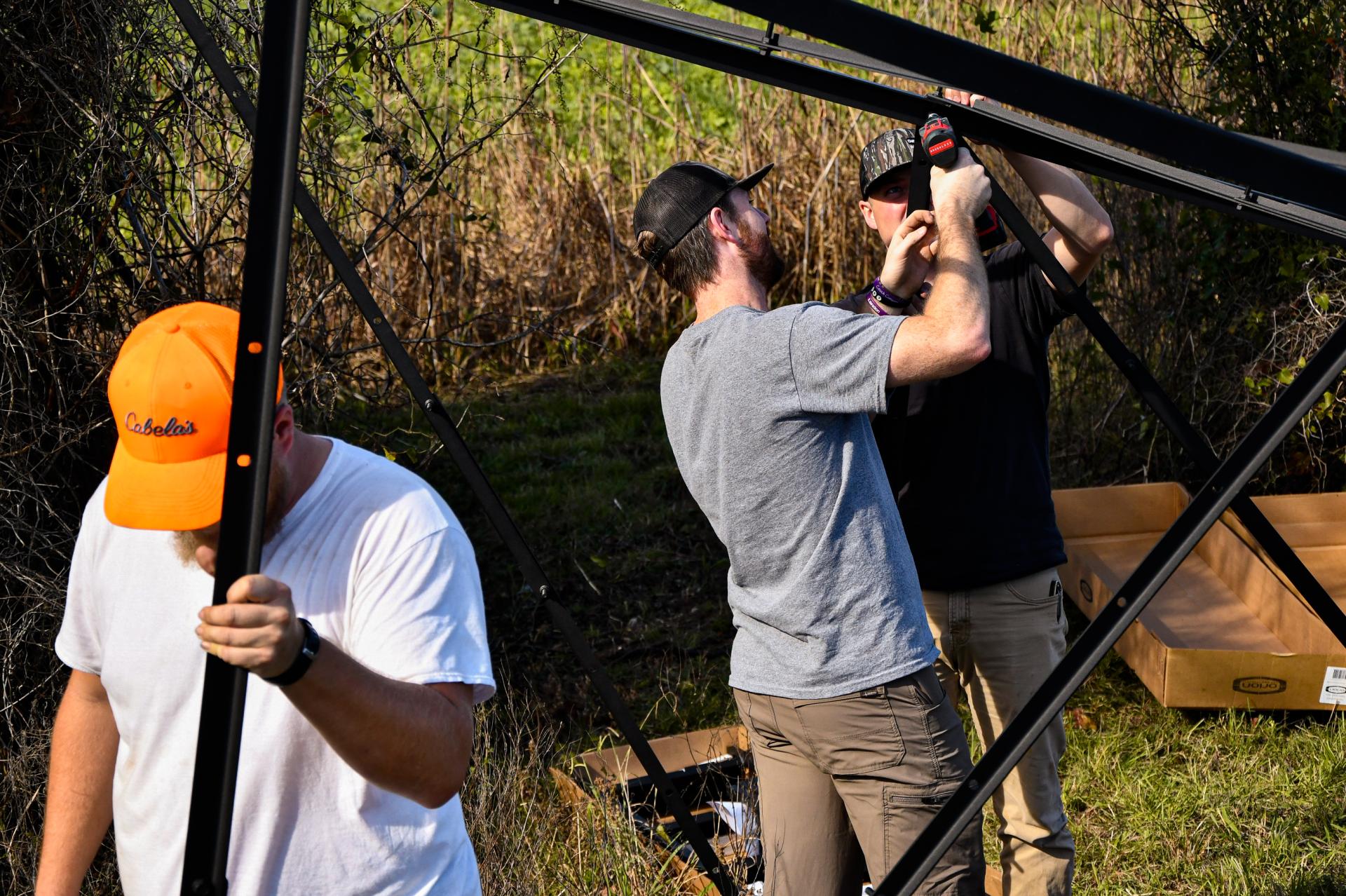 3 men setting up a tower